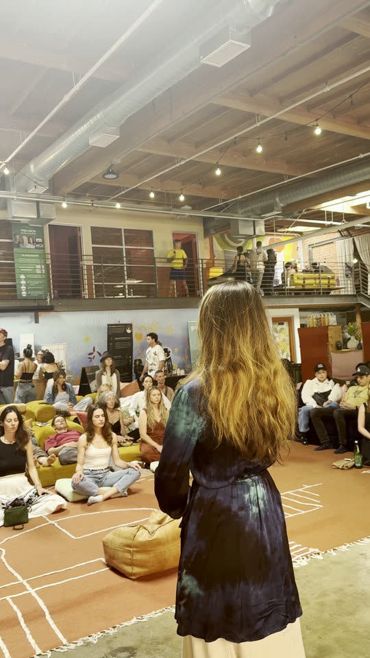 A breathwork session in the main room