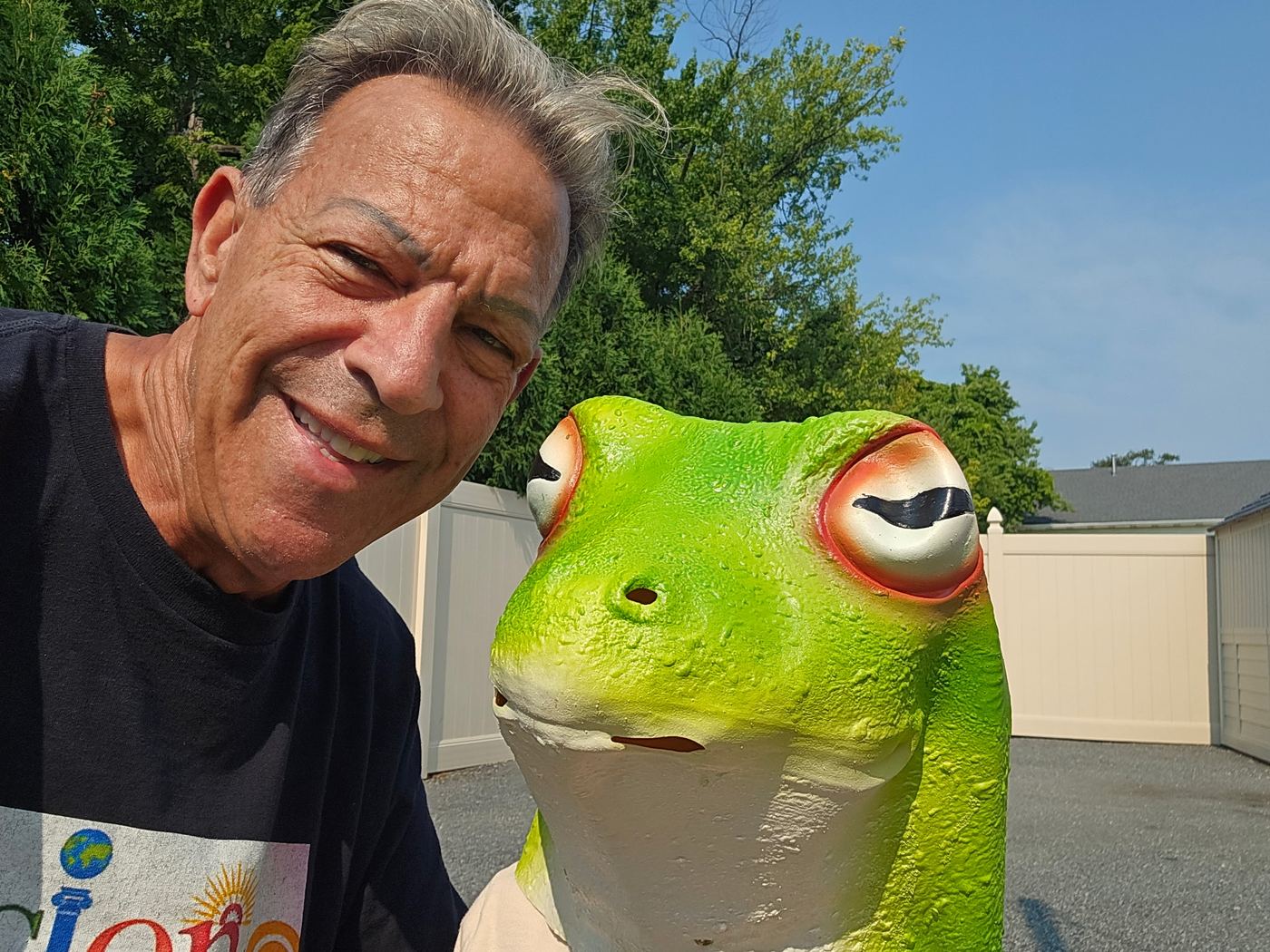 Nature Jack grinning next to a giant frog mask